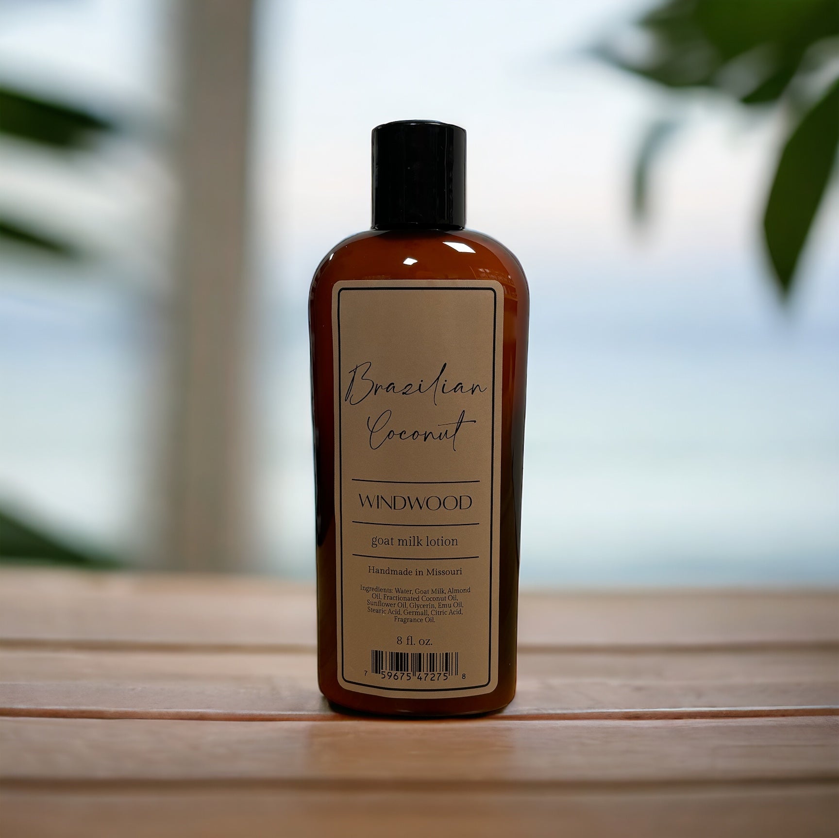 A brown bottle of lotion on a wooden countertop with a plant in the background.